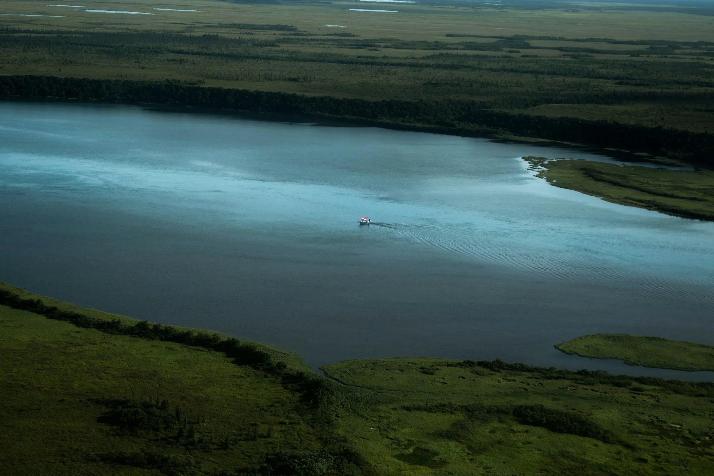 Aerial view of a winding Alaskan river through tundra