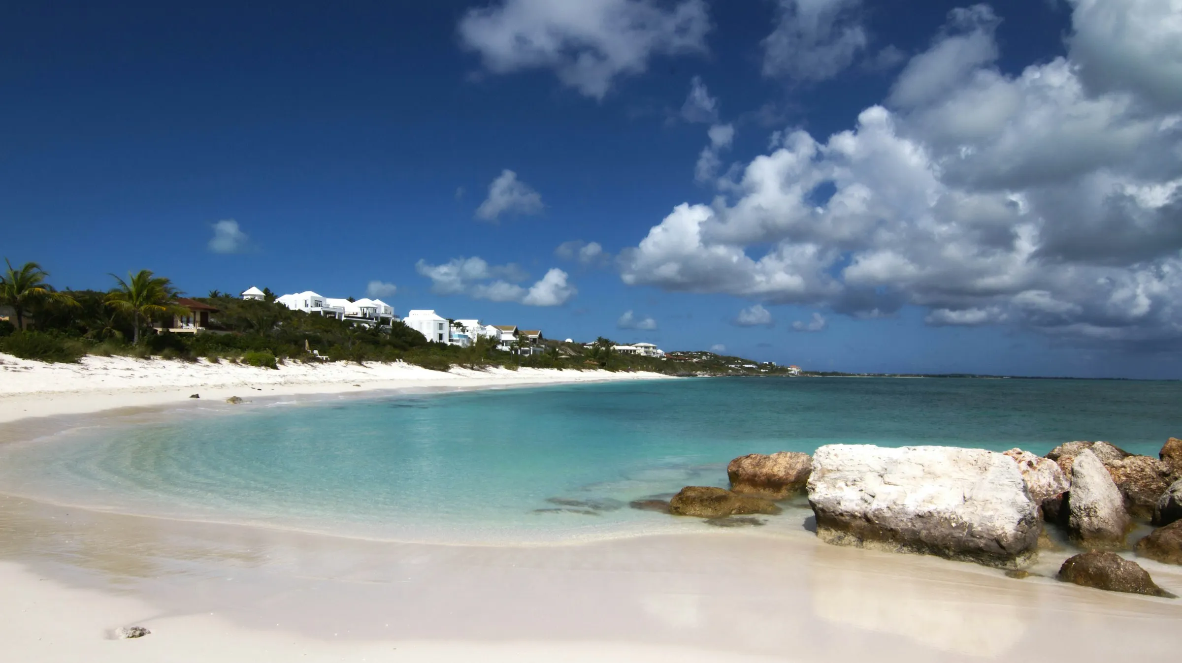 A quiet cove of white sand and clear water