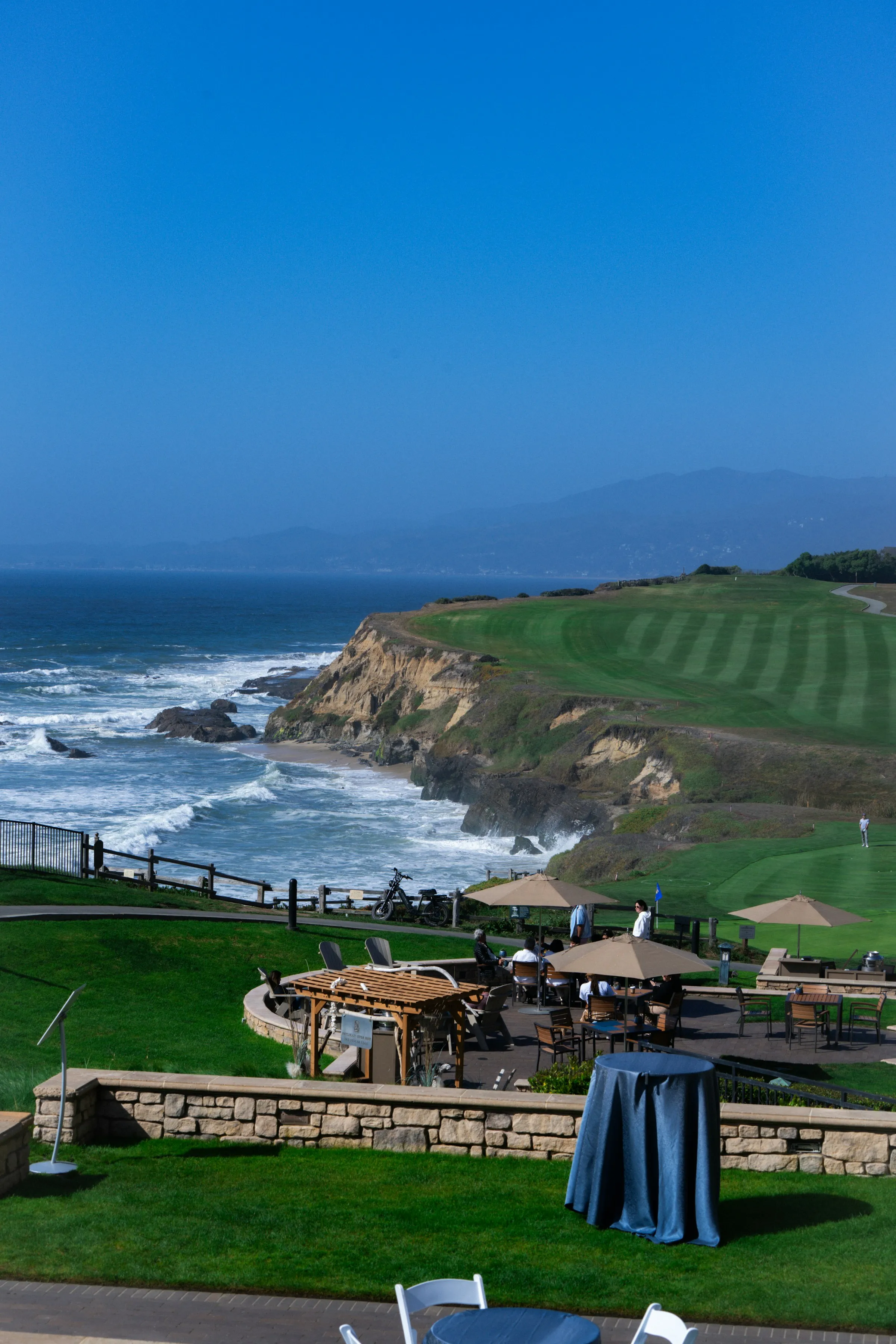 A cliffside golf course above crashing Pacific surf
