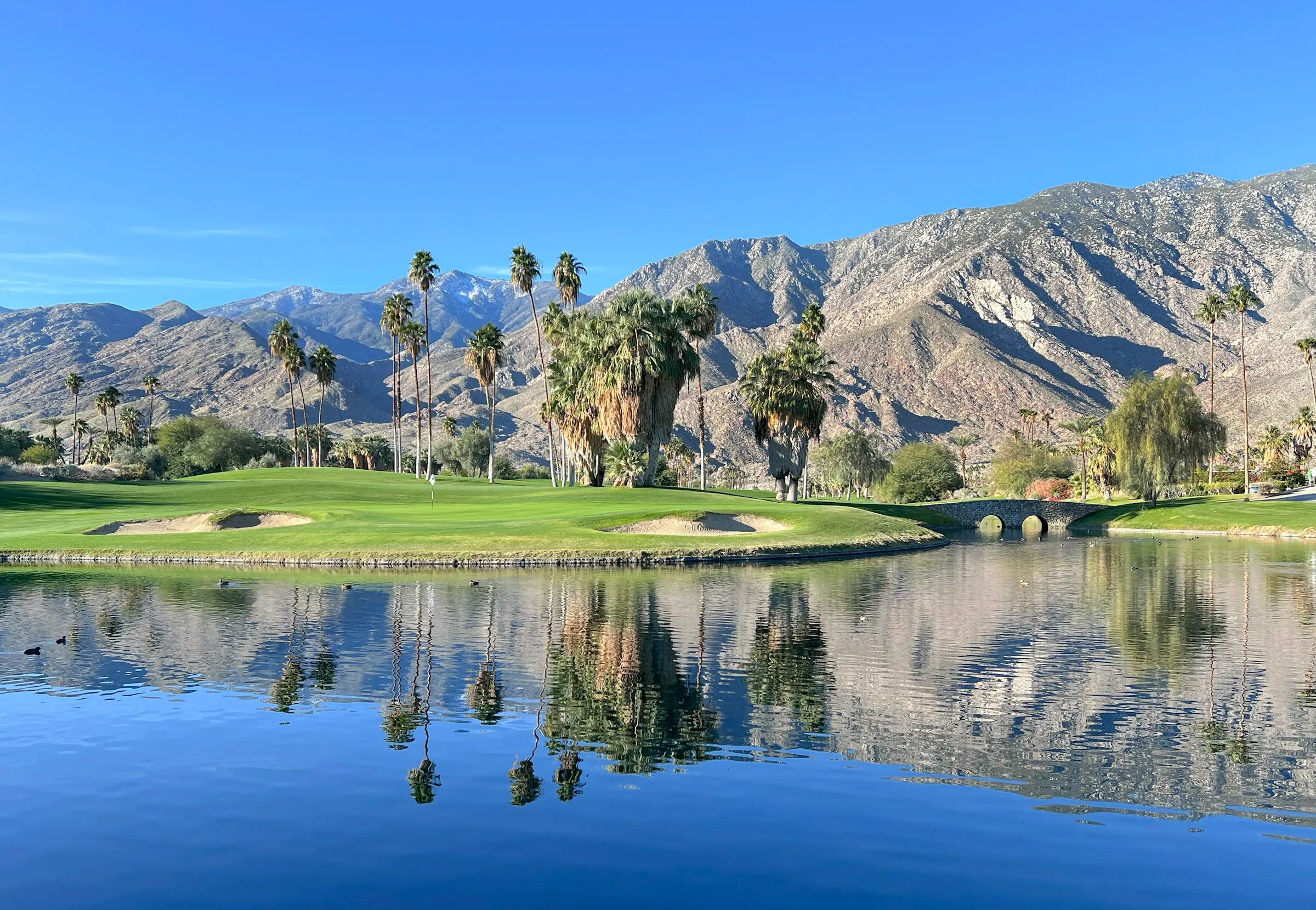A desert golf course with mountains behind, Palm Springs