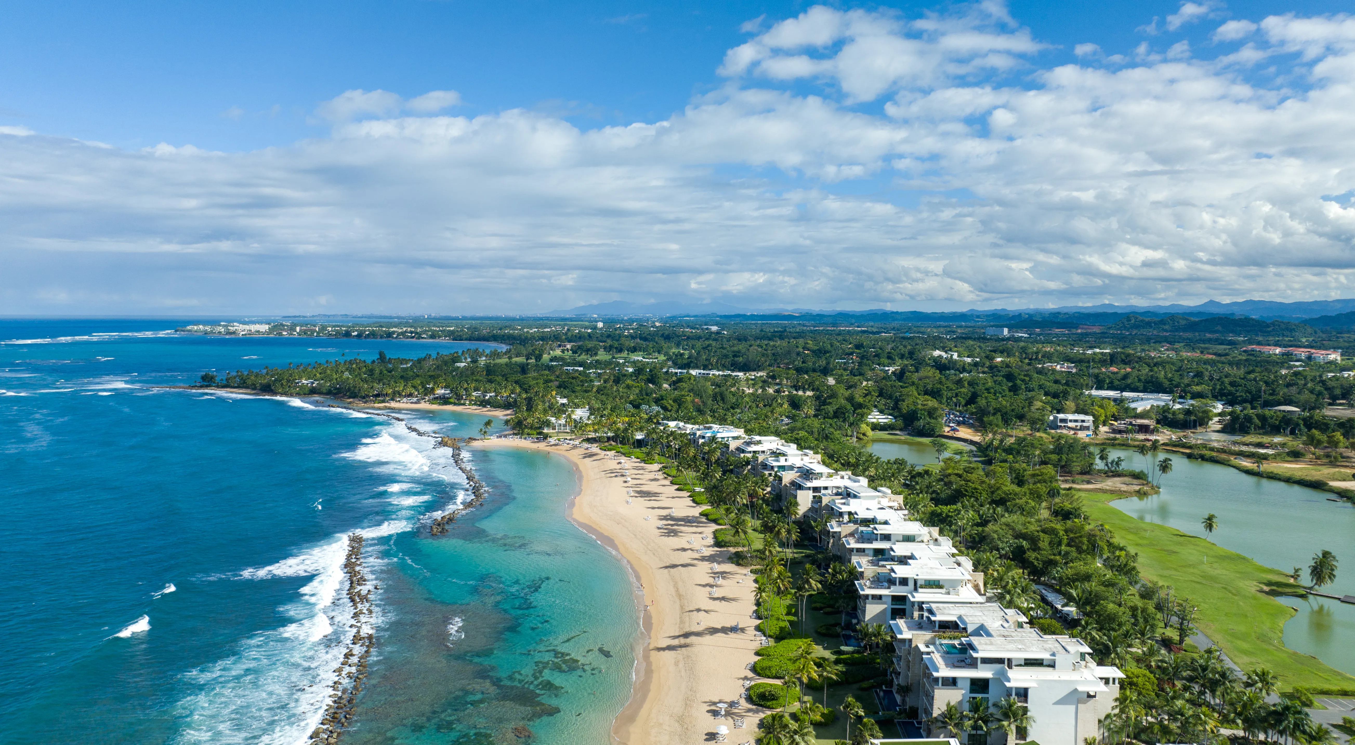 A golf course running down to the Caribbean Sea
