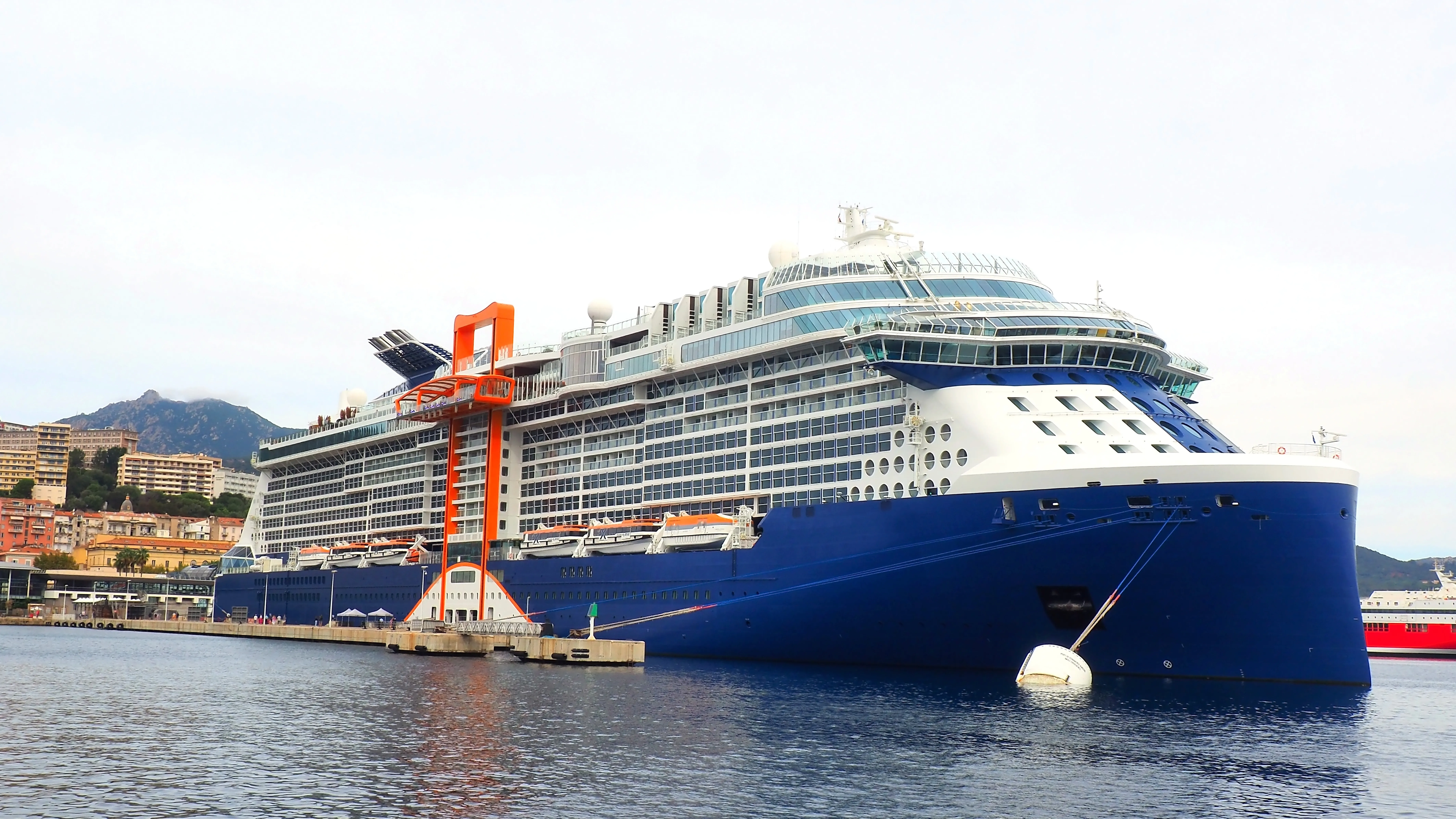 A Celebrity Edge-class ship with the Magic Carpet docked in Ajaccio, Corsica
