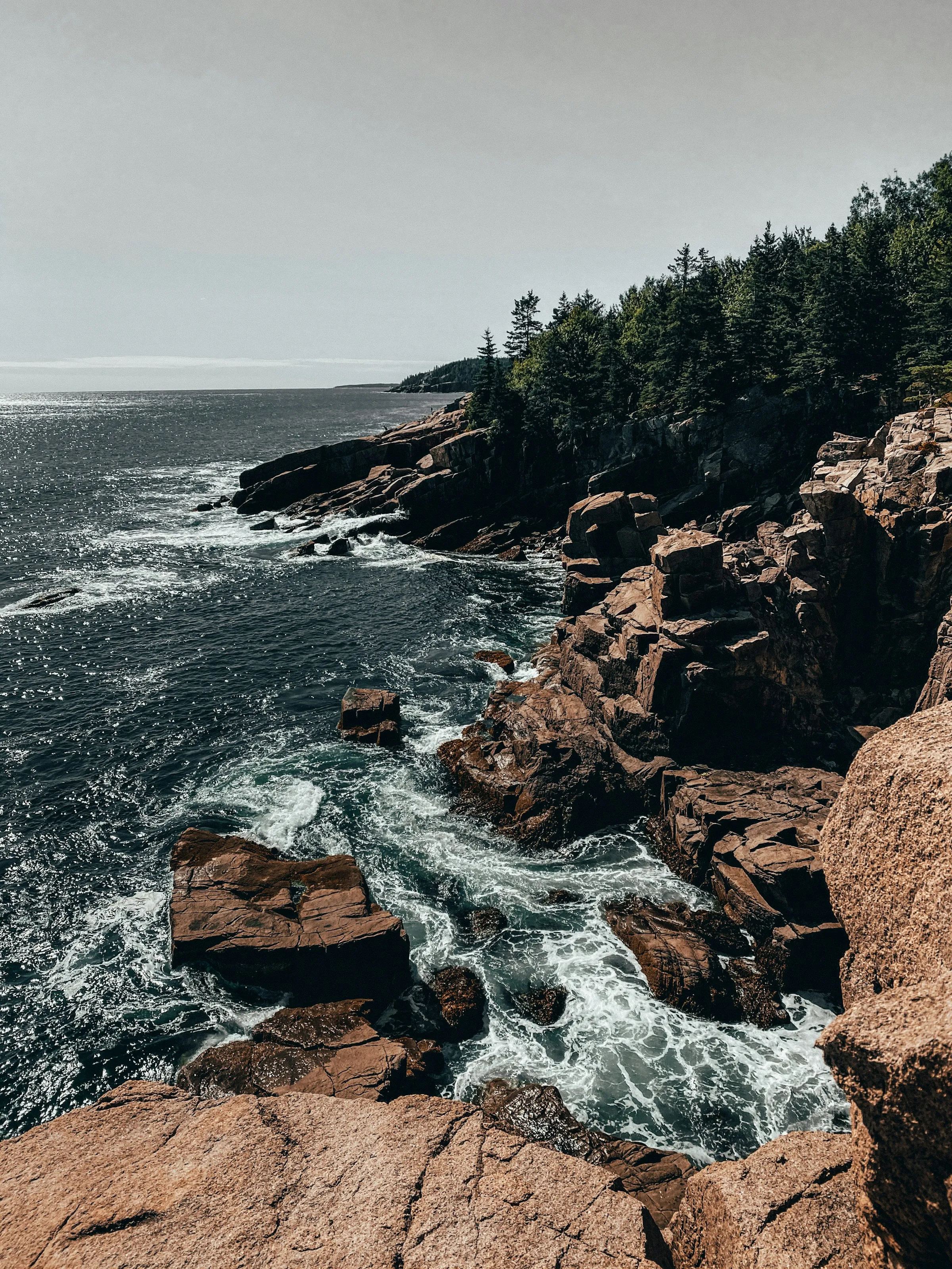Granite shoreline and crashing surf near Acadia National Park, Maine